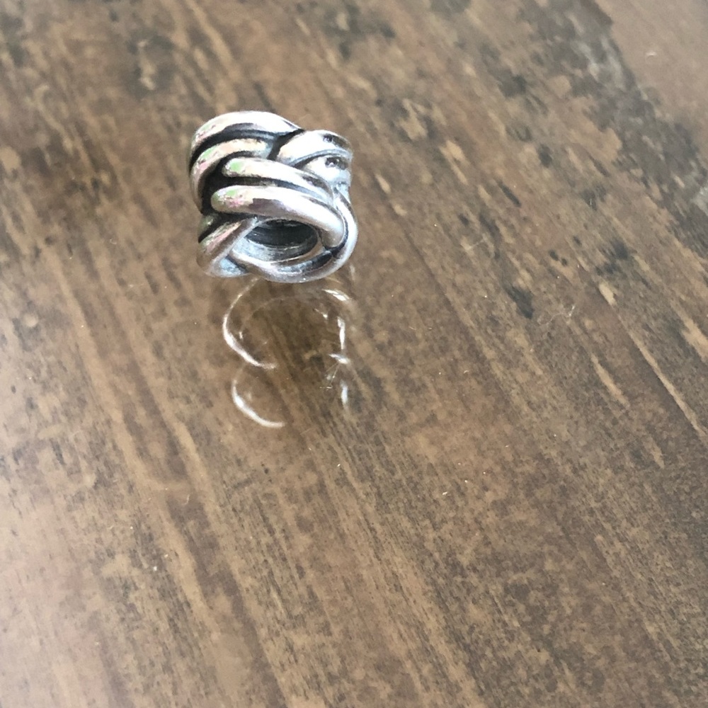 Genuine Pandora Charm. Marked 925 ALE. Love knot design. As new.